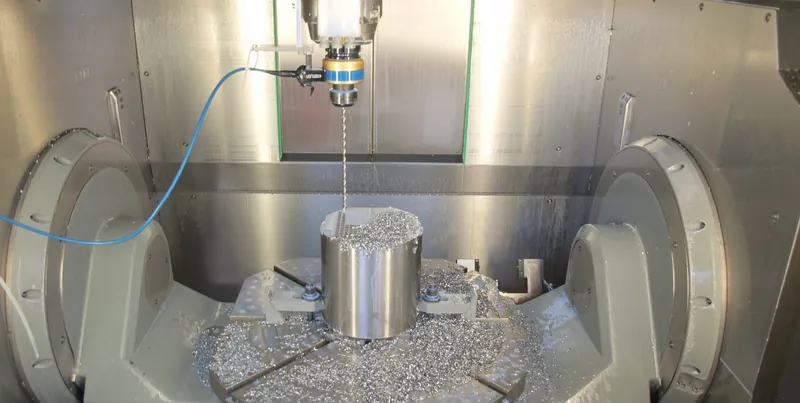 CNC machining centre cutting a metal component