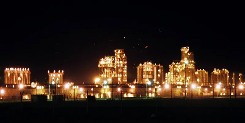 Oil refinery illuminated at night